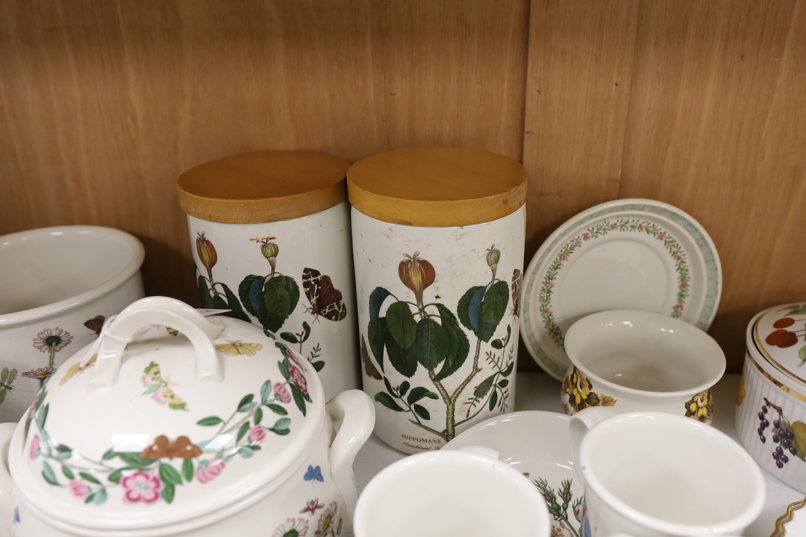 A Royal Worcester Evesham part dinner service, together with Portmeirion items including eight mugs, three lidded tureens, etc.
